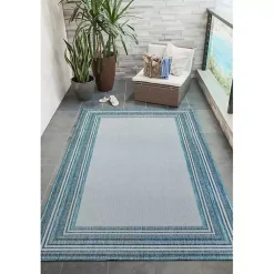 Kirklands Home Ocean Blue Threaded Frame Outdoor Area Rug, 4x7 Hot